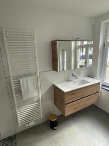 Et badeværelse på Cottage Cozy Gästehaus