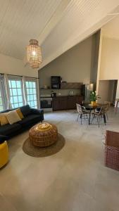 a living room with a couch and a table at Rock Palma Apartments - Cozy, spacious and family friendly in Noord