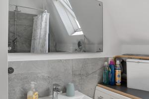 a bathroom with a shower and a sink at Haus Lotte in Wittmund +19 photos