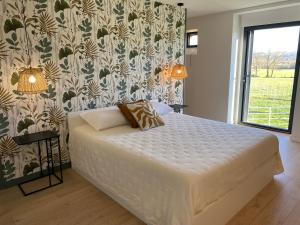 Ένα ή περισσότερα κρεβάτια σε δωμάτιο στο Oh COEUR DU BOUYSSOU