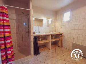 a bathroom with a sink and a shower at Marijolet in Saint-Laurent-dʼOlt +10 photos