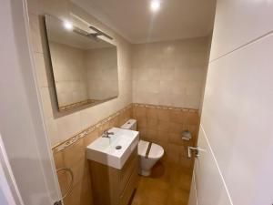 a bathroom with a sink and a toilet at Casa O Curruncho 3000 in Vilagarcia de Arousa +35 photos