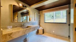 Ένα μπάνιο στο Pousada Villa D'Amore