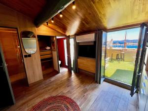 a living room with a large window and a view at Sea Front in La Ciotat