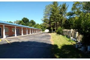 an empty street in front of a brick building at Hotel O Relax Inn Lewisburg near I-64 in Lewisburg
