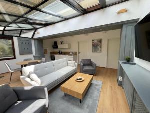 a living room with a couch and a table at Spreewaldapartments-Kossatz in Lübben