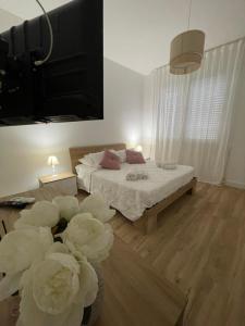 Ένα ή περισσότερα κρεβάτια σε δωμάτιο στο La Casa di Ary