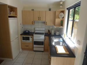 a kitchen with a sink and a stove top oven at Morgano's Star in Fremantle