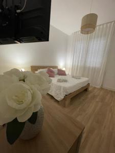 Ένα ή περισσότερα κρεβάτια σε δωμάτιο στο La Casa di Ary