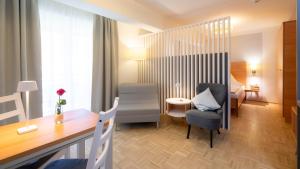 Predel za sedenje v nastanitvi Aparthotel Klopeinersee