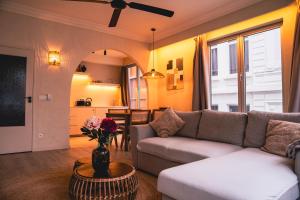 a living room with a couch and a table at Japandi Lofts - 2 Bedrooms at old city of Antwerp in Antwerp