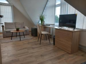 Телевизор и/или развлекательный центр в Vila Rosa