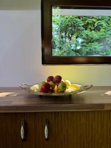 a plate of fruit on top of a counter at Luxury Villa in Cluj-Napoca