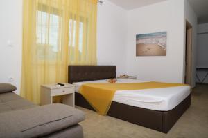 Ένα ή περισσότερα κρεβάτια σε δωμάτιο στο Kassiani Studios