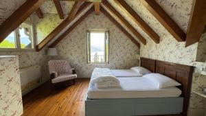 a bedroom with two beds in a attic at Villa Maria in Baveno