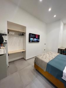 Postel nebo postele na pokoji v ubytování La Stella Di Napoli B&B