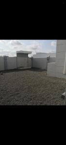 a view of a white building with a roof at فيلا في صحم in Murtafa‘āt Şaḩam