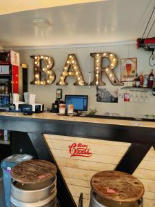 a bar in a restaurant with a bar sign at Arest Vama Veche in Vama Veche