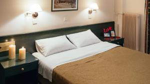 Postel nebo postele na pokoji v ubytování Ignatia Hotel