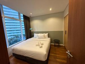 vortex suites klcc by twin tower vibes客房内的一张或多张床位