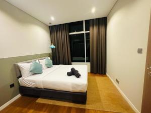 vortex suites klcc by twin tower vibes客房内的一张或多张床位