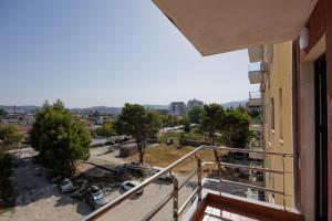 a balcony with a view of a parking lot at Pomegranate House in Vlorë