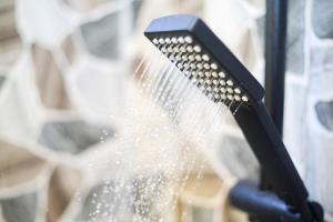 a brush is spraying water on a window at MG Villa, Zanzibar in Mfumbwi