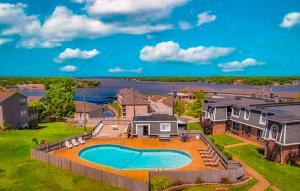 an aerial view of a house with a swimming pool at 1098 Passover Road Unit 203A in Osage Beach