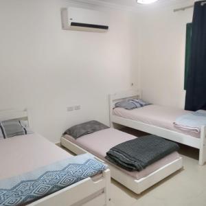 a room with three bunk beds in it at See your sea in Ras Sedr +22 photos