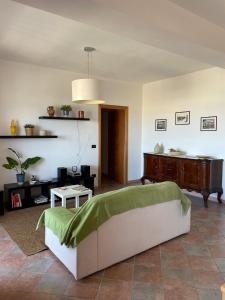 a bedroom with a bed and a table in a room at La Bolina in Cariati