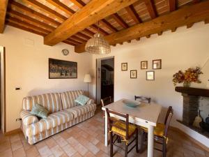 a living room with a couch and a table at Casa Lella in Fabriano