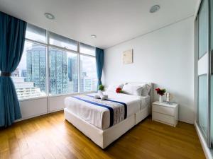 vortex suites klcc by twin tower vibes客房内的一张或多张床位