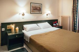 Postel nebo postele na pokoji v ubytování Ignatia Hotel
