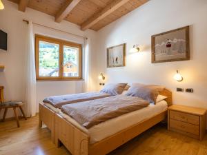 Postel nebo postele na pokoji v ubytování Apartment Cesa Soraruf by Interhome