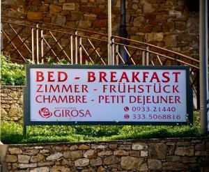 a sign for a bed breakfast on a building at B&B Gi-Rosa Caltagirone in Caltagirone