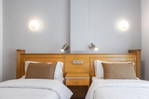 Posteľ alebo postele v izbe v ubytovaní Hotel Agur