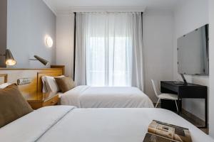 Posteľ alebo postele v izbe v ubytovaní Hotel Agur