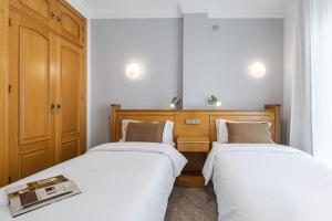 Posteľ alebo postele v izbe v ubytovaní Hotel Agur