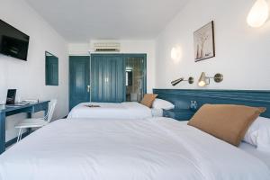 Posteľ alebo postele v izbe v ubytovaní Hotel Agur
