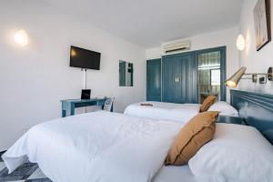 Posteľ alebo postele v izbe v ubytovaní Hotel Agur
