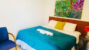 Un ou plusieurs lits dans un hébergement de l'établissement Inn House Santa Teresa
