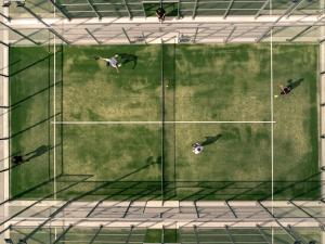 a group of people on a tennis court at Château D'artigny in Montbazon
