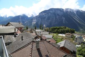 a view of a town with mountains in the background at B&B Zum Schleif in Varen