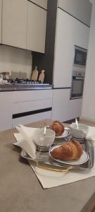 a kitchen with a table with plates of food on it at La casa di Francesca in Tradate
