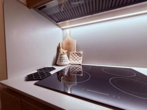 a counter with some utensils on a counter top at Suite Salgemma in Polignano a Mare