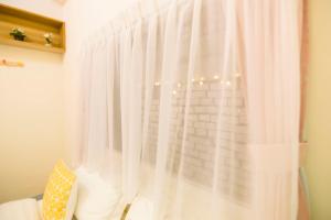 Letto o letti in una camera di One Heart Inn