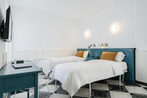 Posteľ alebo postele v izbe v ubytovaní Hotel Agur