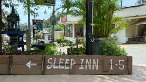 a sign that says sleep inn on the side of a street at Sleep Inn - Lonely Beach in Ko Chang +3 photos