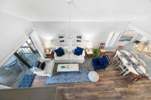 an overhead view of a living room with blue furniture at Ventura Captiva 2B condo in Captiva +31 photos