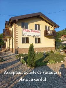 a casa angelica building with a sign on it at Casa Anghel Ocnele Mari in Ocnele Mari